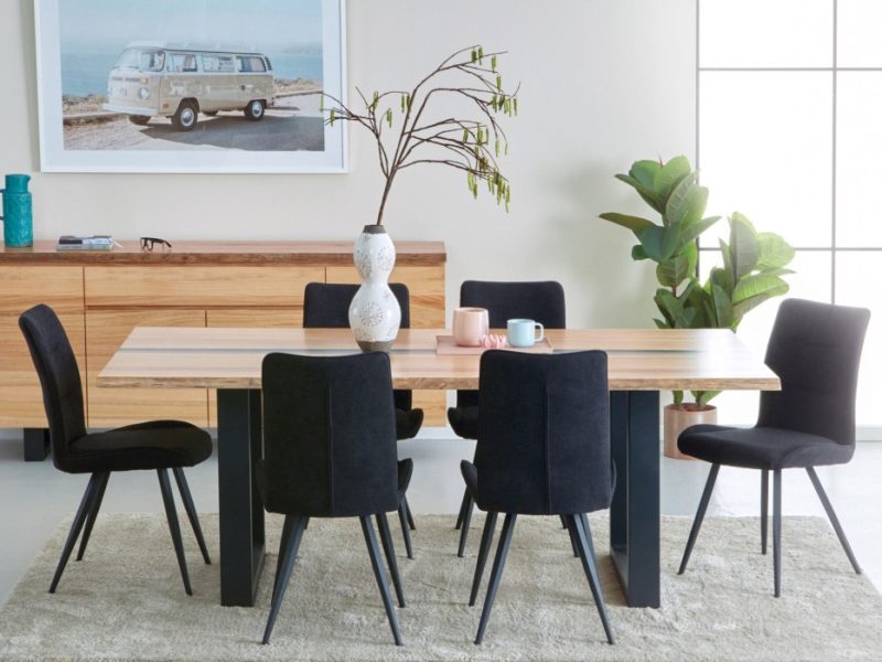 Timber dining table with black upholstered chairs from Bestfurn