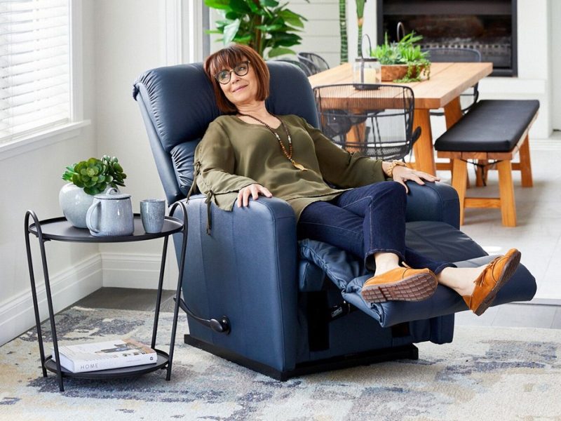 Woman relaxing in a navy La-Z-Boy recliner
